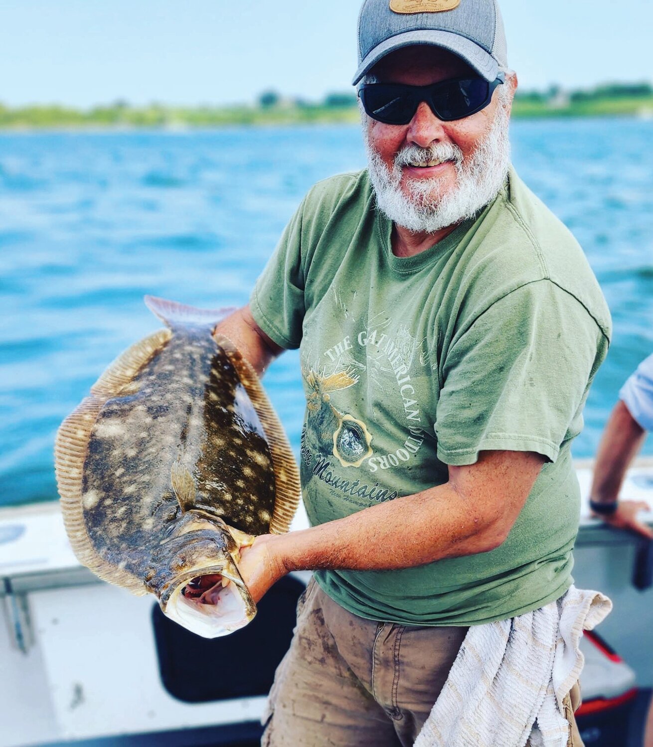 FLUKE BITE ON:  Paul Philips of North Kingstown with the nine pound summer flounder he caught in deep water off Newport last week on ArchAngel Charters.